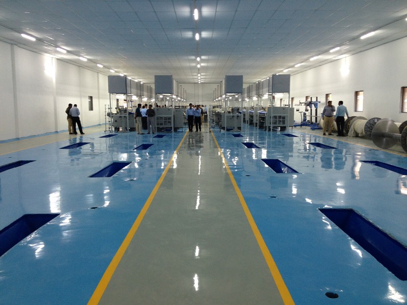 This image shows a manufacturing plant with epoxy painted floor.