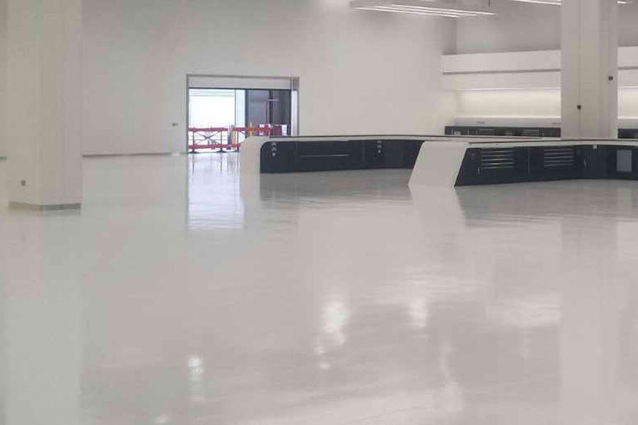 This image shows a commercial space with white epoxy floor.