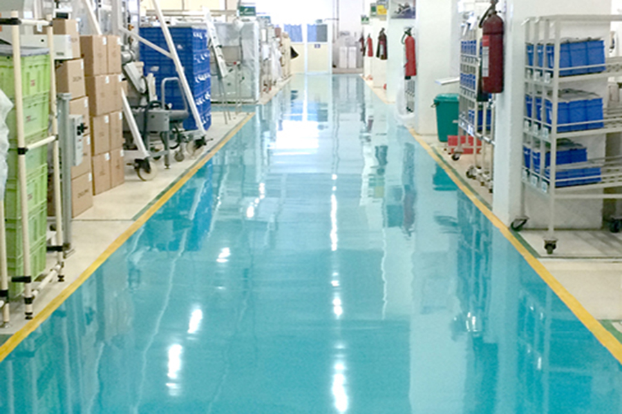 This image shows a manufacturing plant with an epoxy floor.