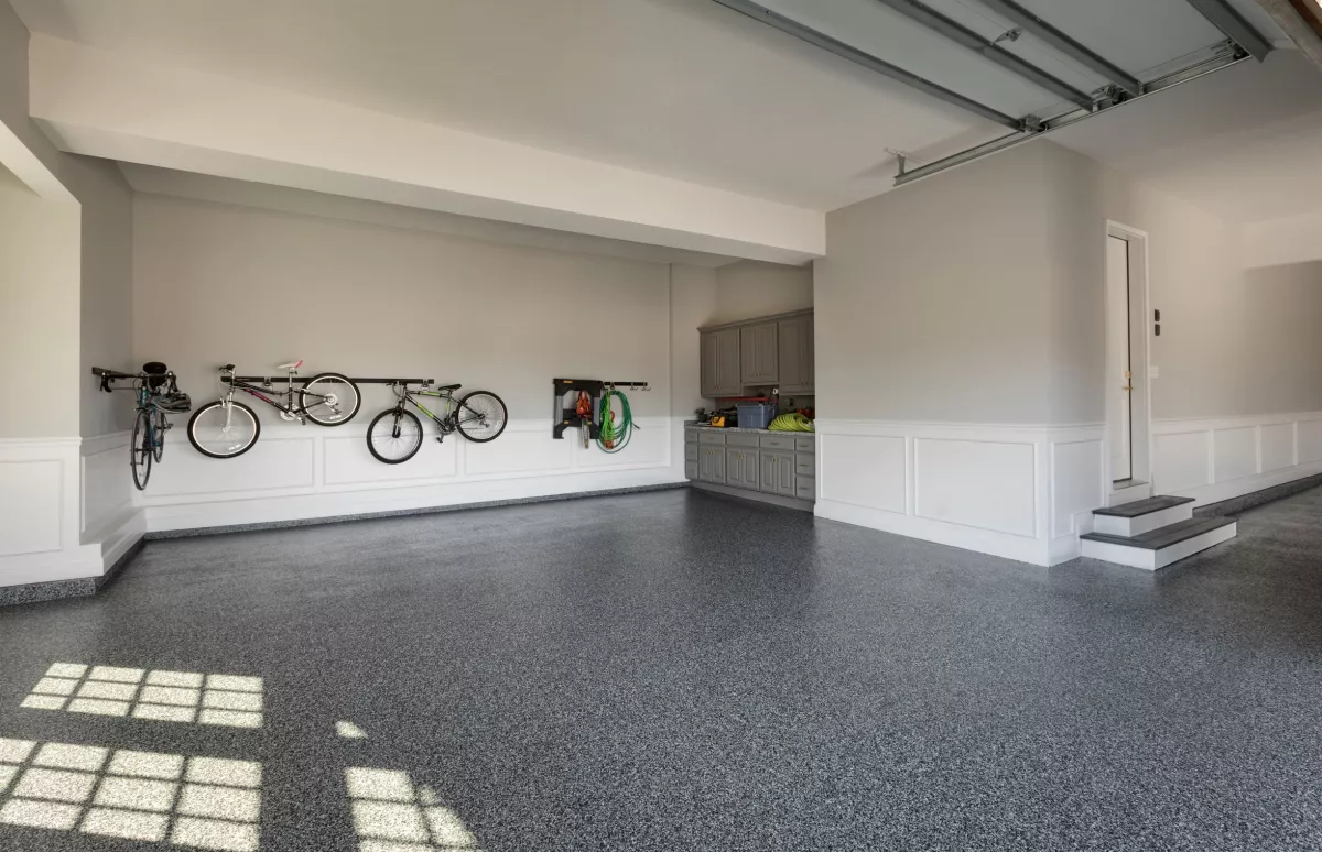 This image shows a garage floor with a flake epoxy floor.
